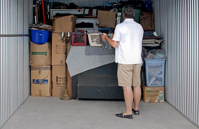 A person looking at an open storage unit