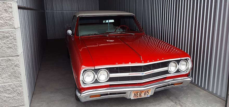 Red vintage car in storage unit