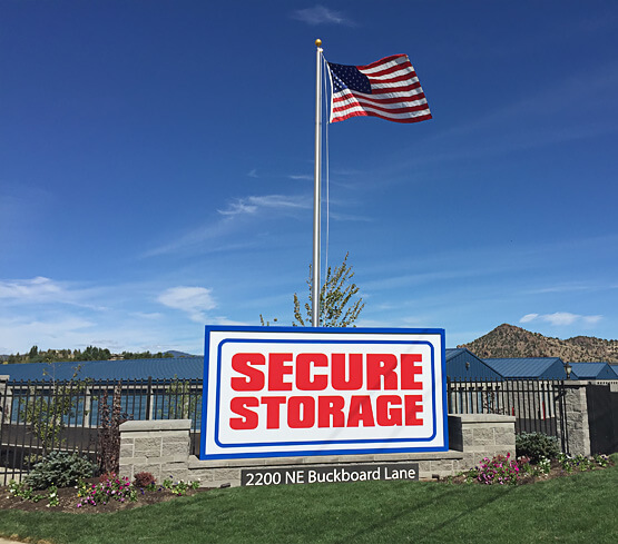 Prineville location front sign with American flag